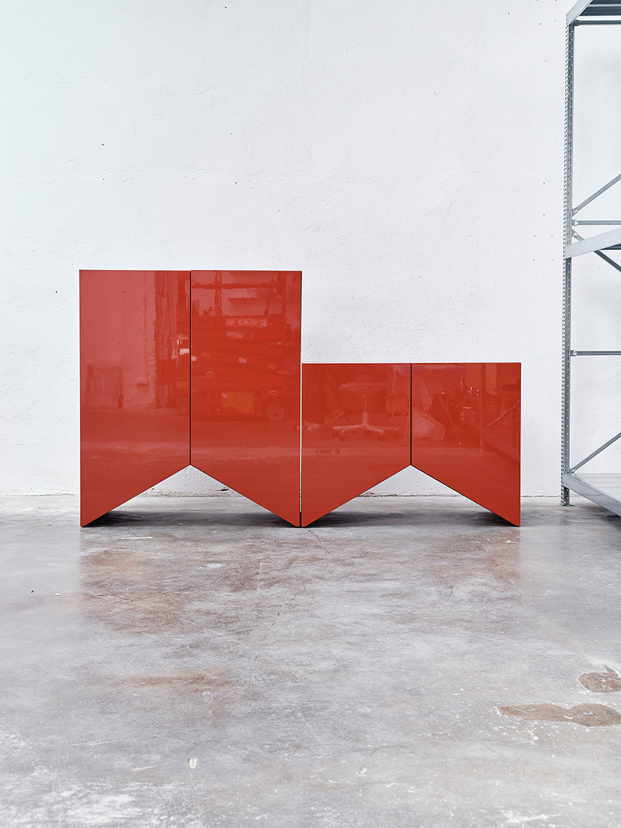 modern red glossy cabinet with a geometric design