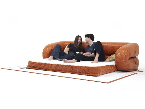Side profile of the Anfibio Sofa highlighting its soft curves and sculptural silhouette.