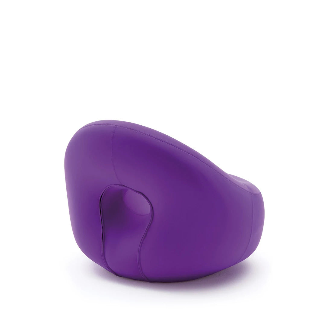 Side profile of the Bolle Armchair showing its rounded bubble-inspired silhouette.