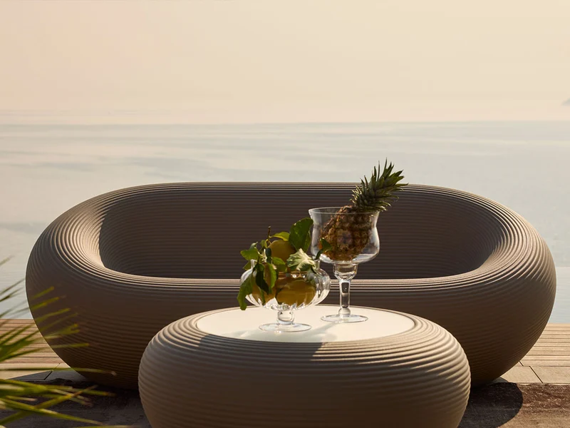 Qeeboo Nami Low Table in outdoor lifestyle setting with modern seating and sculptural design