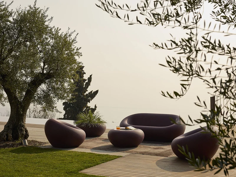 Nami Low Table by Qeeboo in outdoor terrace setting, sculptural Italian low table