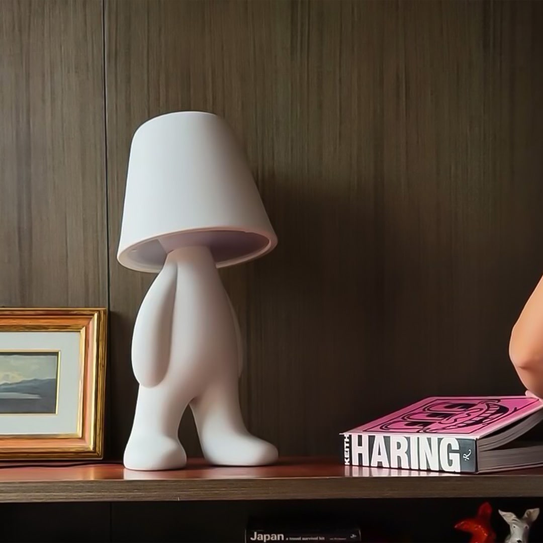 Qeeboo Bigger Brother Floor Lamps in green and white emitting soft ambient light