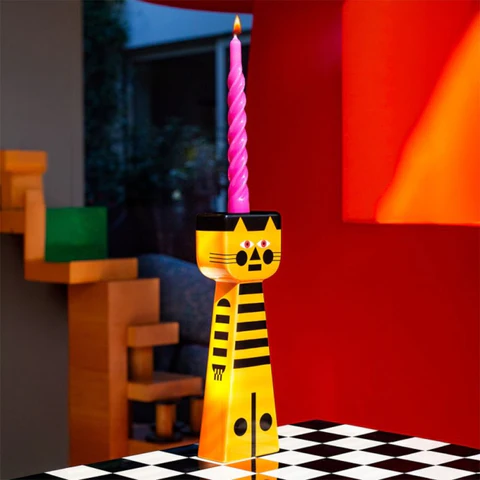Qeeboo Candle holder shaped like a tiger with a pink candle on a checkered floor.