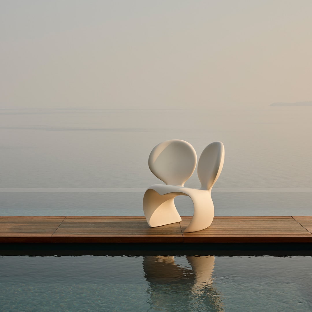 Don't F**k With The Mouse Armchair placed outdoors, weather‑resistant recyclable polyethylene, designed by Ron Arad for Qeeboo.
