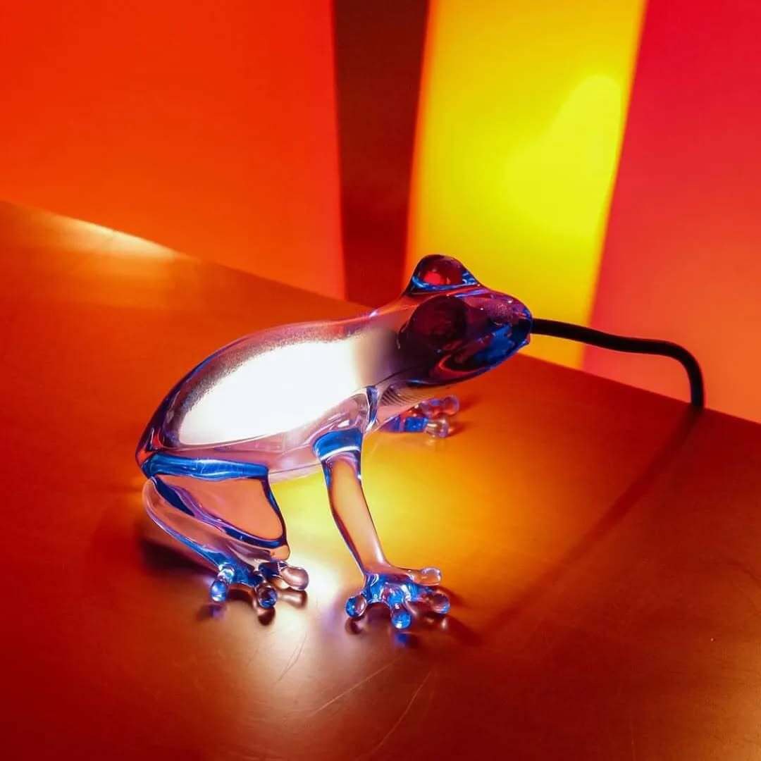 Sculptural frog lamp appearing to eat the LED light