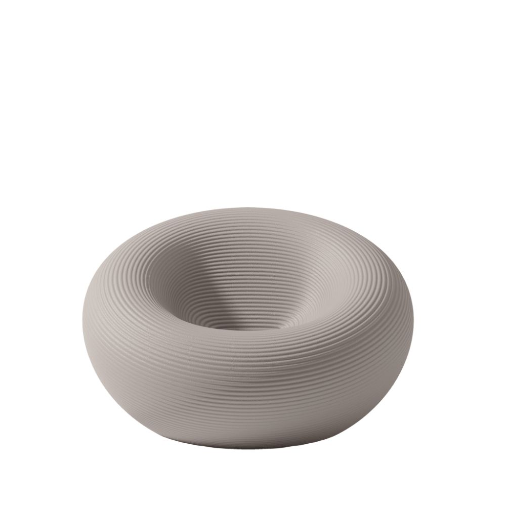Qeeboo Nami Outdoor Armchair featuring sculptural wave‑inspired silhouette in durable weather‑resistant material