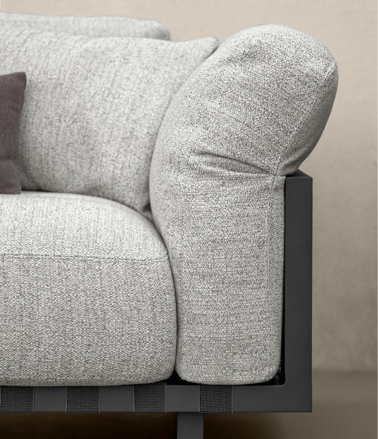 Close-up of modern grey fabric sofa armrest